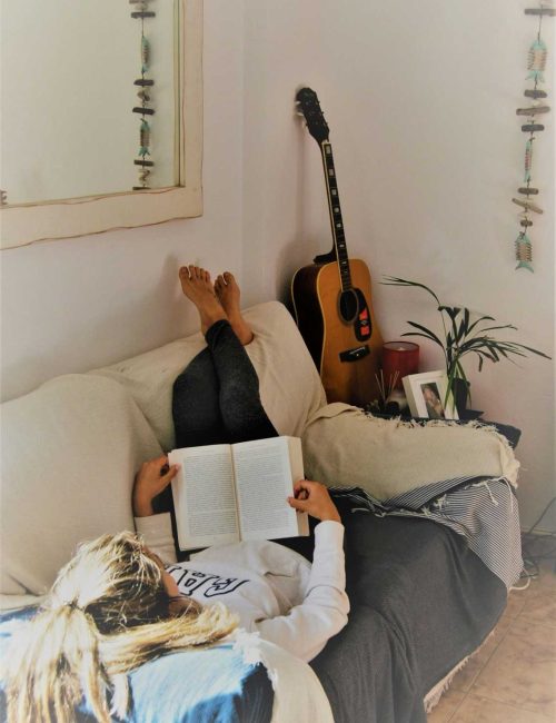 Person Relaxing in Sofa